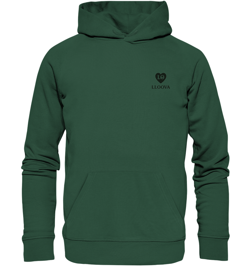 LLOOVA donation hoodie with an urban look in front of a gray concrete wall ot transparent background